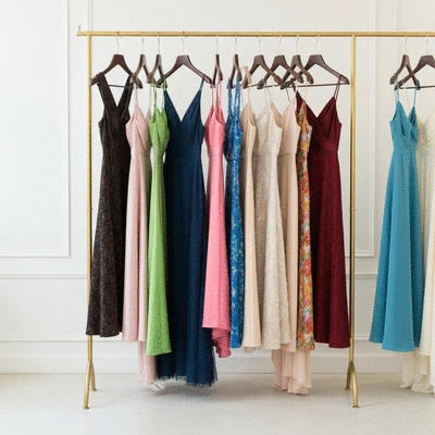 A collection of fashionable cocktail dresses in various lengths displayed on a rack